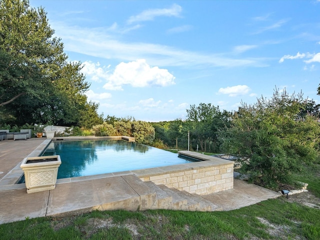 186 Deer Creek Dr, Aledo, TX 76008 - view of pool with an infinity pool and a patio