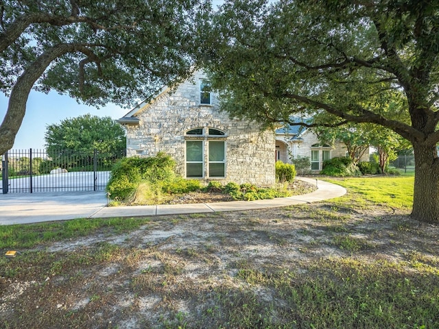 186 Deer Creek Dr, Aledo, TX 76008 - view of property exterior featuring stone siding and a gate