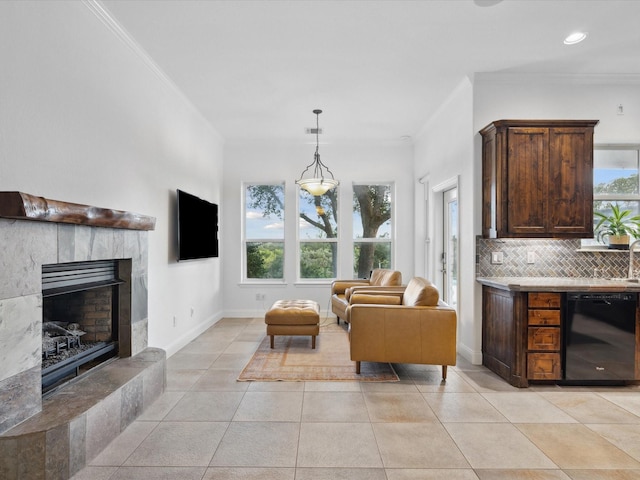 186 Deer Creek Dr, Aledo, TX 76008 - living room featuring crown molding, light tile patterned floors, a tiled fireplace, and recessed lighting