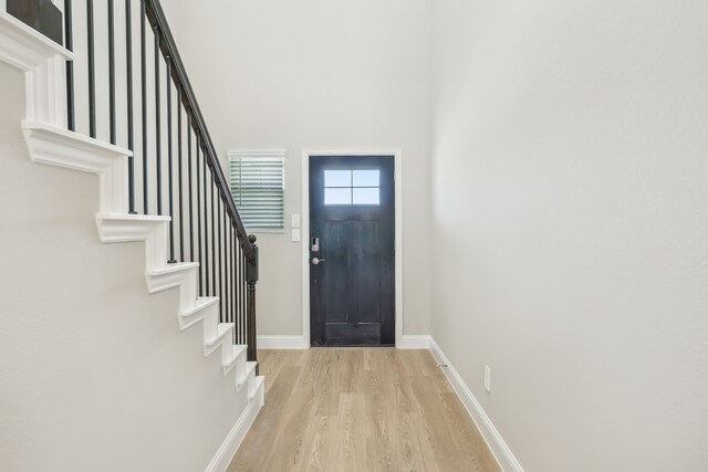 505 Willet Dr, Mckinney, TX 75069 - foyer entrance featuring light wood-type flooring, stairway, and a high ceiling
