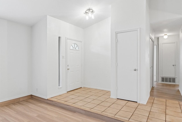 1109 Paluxy Ct, Flower Mound, TX 75028 - entryway with light wood-type flooring and baseboards