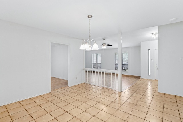 1109 Paluxy Ct, Flower Mound, TX 75028 - empty room with a chandelier, light tile patterned flooring, and a smoke detector