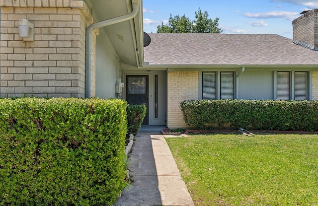 1109 Paluxy Ct, Flower Mound, TX 75028 - entrance to property with a yard, brick siding, a shingled roof, and a chimney