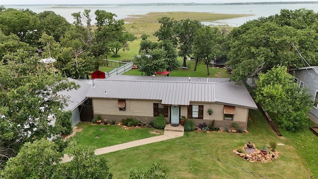 10234 County Road 198, Breckenridge, TX 76424 - view of front of property with a water view, a metal roof, and a front lawn