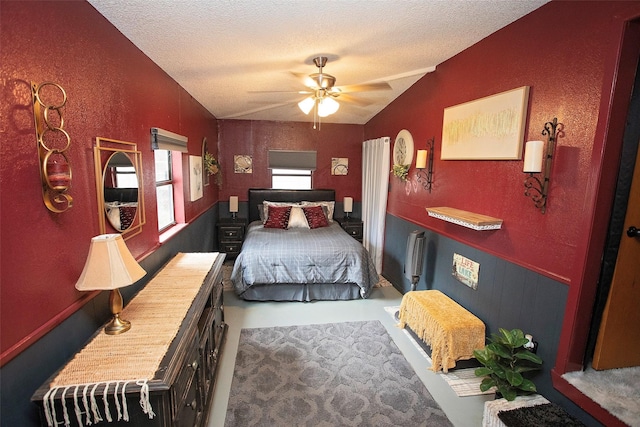 10234 County Road 198, Breckenridge, TX 76424 - bedroom featuring a textured ceiling, vaulted ceiling, and a ceiling fan