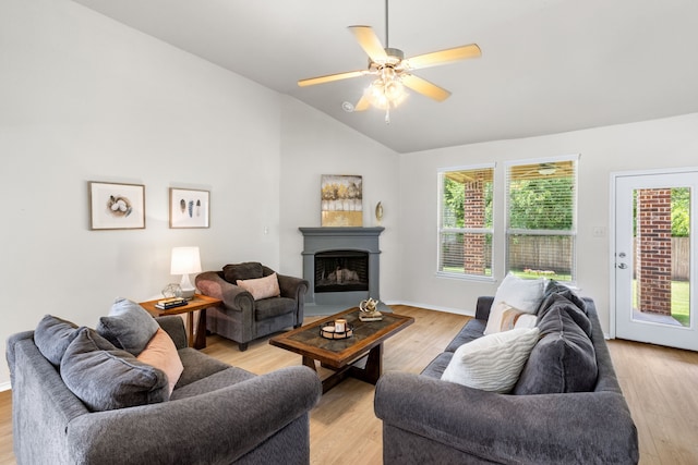 584 Indian Hill Dr, Oak Point, TX 75068 - living room featuring vaulted ceiling, light wood finished floors, a fireplace, and ceiling fan