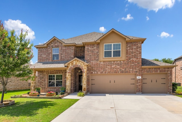 584 Indian Hill Dr, Oak Point, TX 75068 - traditional-style home featuring brick siding, concrete driveway, roof with shingles, and a front lawn