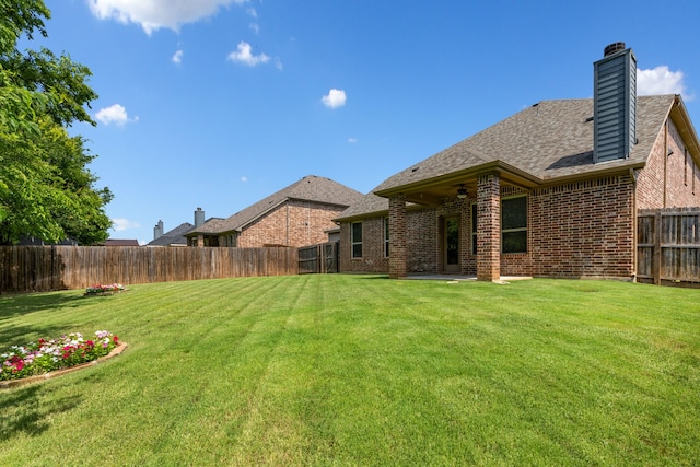 584 Indian Hill Dr, Oak Point, TX 75068 - fenced backyard featuring ceiling fan and a patio area