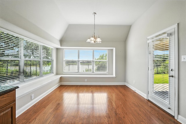 8120 Tyler Dr, Lantana, TX 76226 - unfurnished dining area featuring a chandelier, wood finished floors, and lofted ceiling