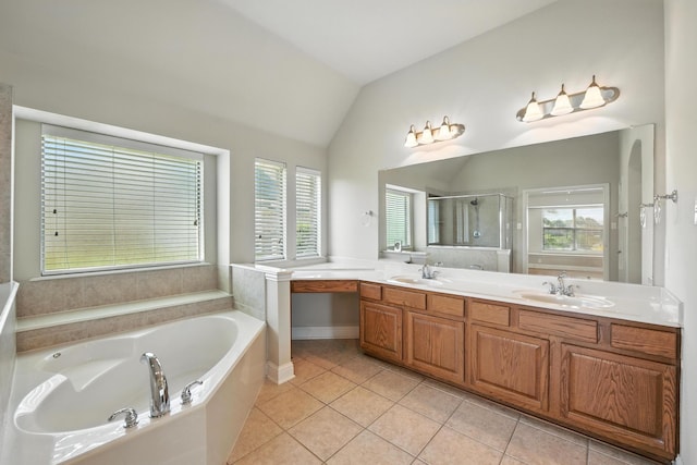 8120 Tyler Dr, Lantana, TX 76226 - full bathroom featuring a bath, a stall shower, tile patterned floors, double vanity, and vaulted ceiling