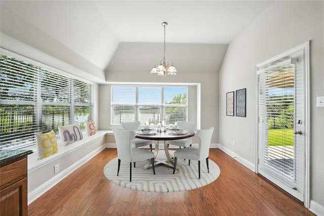 8120 Tyler Dr, Lantana, TX 76226 - dining room featuring a chandelier, wood finished floors, and lofted ceiling