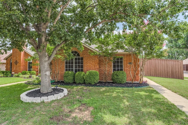 2102 Overview Ln, Garland, TX 75044 - view of property hidden behind natural elements featuring brick siding