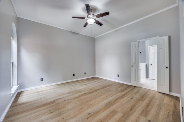 2102 Overview Ln, Garland, TX 75044 - unfurnished room featuring a ceiling fan, light wood finished floors, ornamental molding, and arched walkways