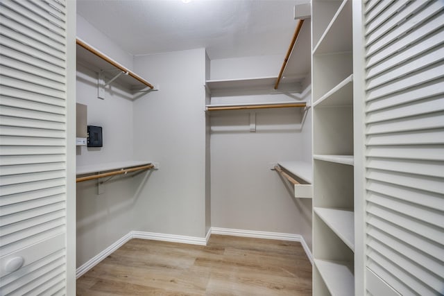 2102 Overview Ln, Garland, TX 75044 - spacious closet with wood finished floors