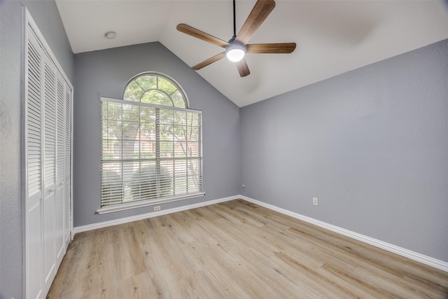 2102 Overview Ln, Garland, TX 75044 - unfurnished bedroom featuring vaulted ceiling, a closet, light wood-type flooring, and ceiling fan