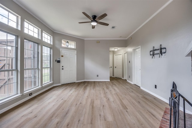 2102 Overview Ln, Garland, TX 75044 - unfurnished living room with crown molding, ceiling fan, and light wood finished floors