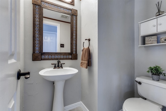 17712 Meadow Grove Ln, Dallas, TX 75287 - bathroom featuring toilet and baseboards