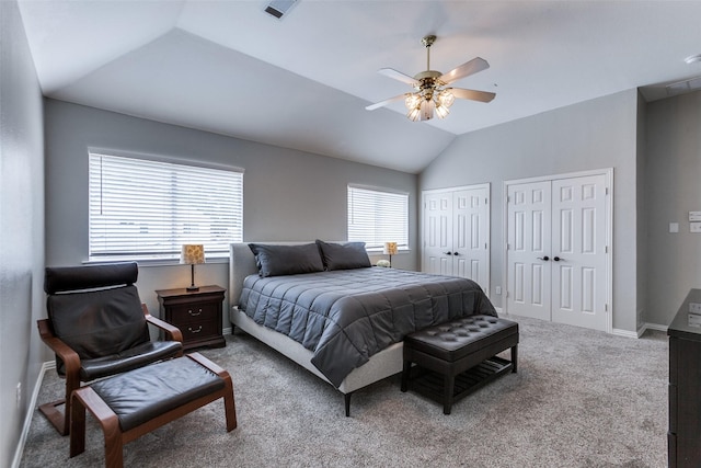 17712 Meadow Grove Ln, Dallas, TX 75287 - bedroom with multiple closets, lofted ceiling, carpet flooring, and a ceiling fan