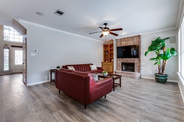 17712 Meadow Grove Ln, Dallas, TX 75287 - living room featuring wood finished floors, ceiling fan, a fireplace, and ornamental molding