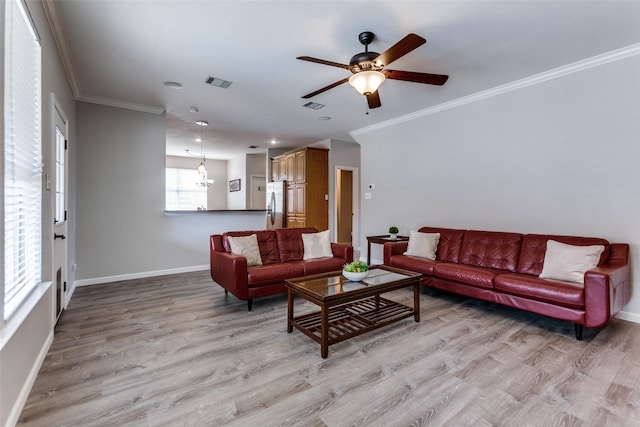 17712 Meadow Grove Ln, Dallas, TX 75287 - living room featuring light wood-style floors, a ceiling fan, and ornamental molding