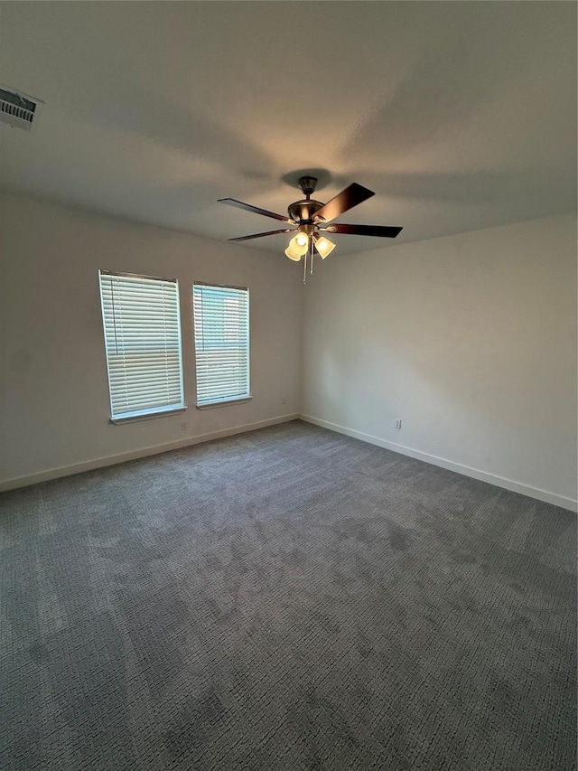 1019 E Waco Ave, Dallas, TX 75216 - empty room with a ceiling fan and dark colored carpet