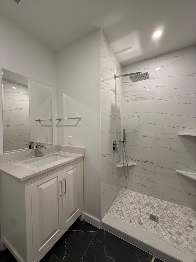 1019 E Waco Ave, Dallas, TX 75216 - bathroom featuring marble look tile flooring, vanity, a marble finish shower, and recessed lighting