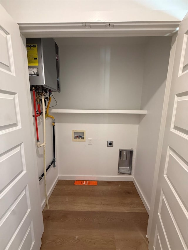 1019 E Waco Ave, Dallas, TX 75216 - washroom featuring washer hookup, wood finished floors, tankless water heater, and hookup for an electric dryer