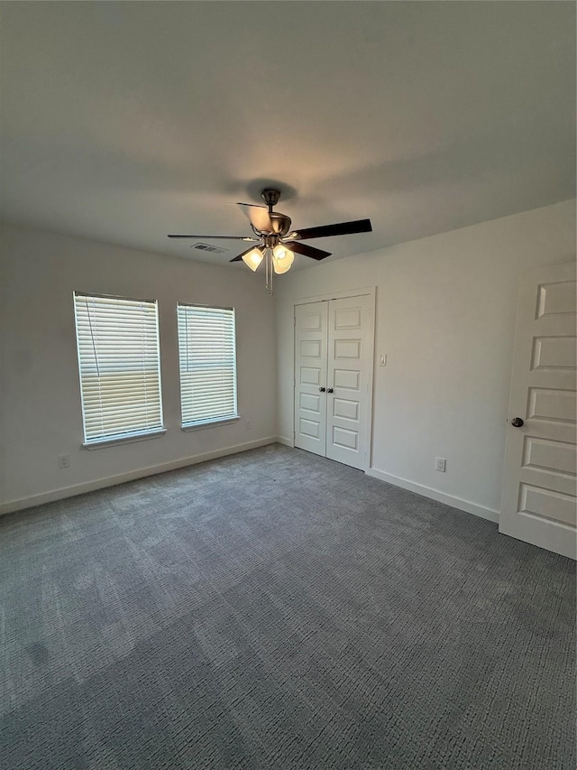 1019 E Waco Ave, Dallas, TX 75216 - unfurnished bedroom featuring carpet, ceiling fan, and a closet