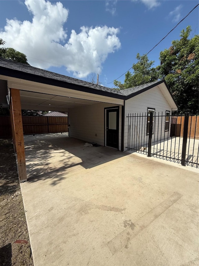 1019 E Waco Ave, Dallas, TX 75216 - view of front of property featuring concrete driveway and an attached carport