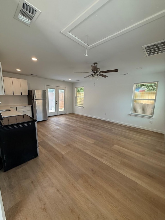 1019 E Waco Ave, Dallas, TX 75216 - unfurnished living room featuring attic access, recessed lighting, light wood-style flooring, and a ceiling fan
