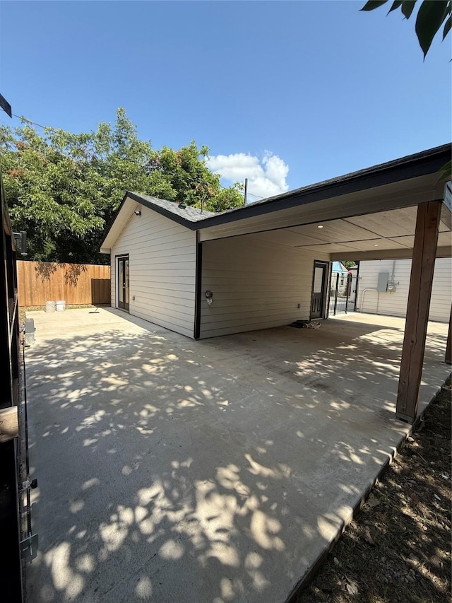 1019 E Waco Ave, Dallas, TX 75216 - view of home's exterior with a patio and an attached carport