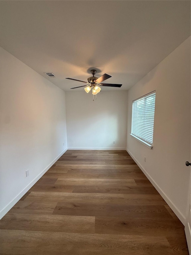 1019 E Waco Ave, Dallas, TX 75216 - unfurnished room with a ceiling fan and wood finished floors