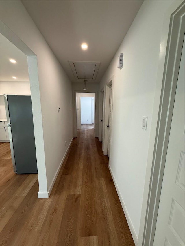 1019 E Waco Ave, Dallas, TX 75216 - corridor featuring attic access and wood finished floors