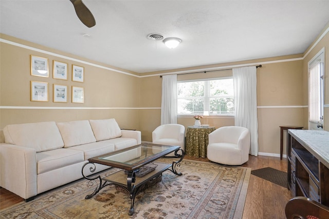 5428 Sabelle Ln, Haltom City, TX 76117 - living area featuring wood finished floors, healthy amount of natural light, and crown molding