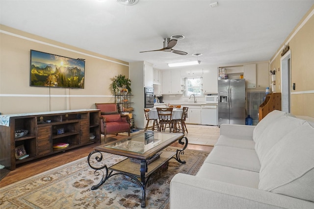 5428 Sabelle Ln, Haltom City, TX 76117 - living room with a wainscoted wall and ceiling fan
