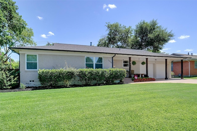 5428 Sabelle Ln, Haltom City, TX 76117 - ranch-style home with brick siding, a garage, and a front lawn