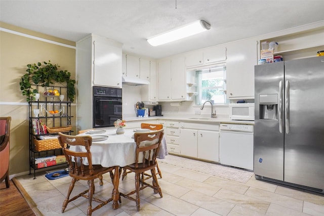 5428 Sabelle Ln, Haltom City, TX 76117 - kitchen with white appliances, light countertops, open shelves, under cabinet range hood, and white cabinets