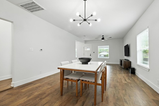 1415 W St, Mckinney, TX 75069 - dining area with a chandelier, wood finished floors, and a ceiling fan