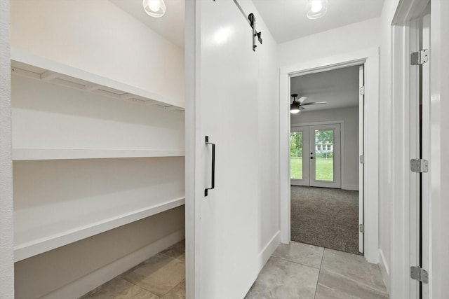 1415 W St, Mckinney, TX 75069 - hall featuring light tile patterned floors and french doors