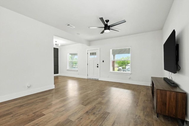 1415 W St, Mckinney, TX 75069 - unfurnished living room featuring ceiling fan and dark wood finished floors