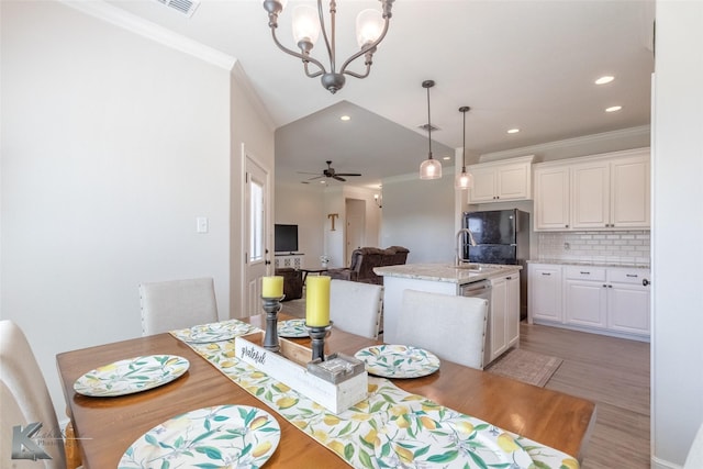 7309 Wildflower Way, Abilene, TX 79602 - dining area with crown molding, a chandelier, light wood finished floors, recessed lighting, and a ceiling fan