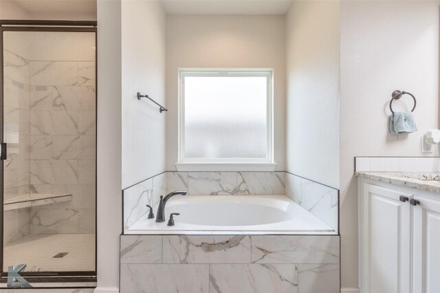 7309 Wildflower Way, Abilene, TX 79602 - bathroom with a shower stall, a bath, and vanity