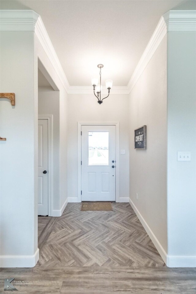 7309 Wildflower Way, Abilene, TX 79602 - foyer entrance featuring crown molding and a chandelier
