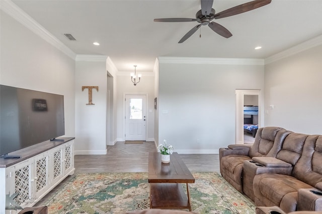 7309 Wildflower Way, Abilene, TX 79602 - living area featuring wood finished floors, crown molding, ceiling fan, a chandelier, and recessed lighting