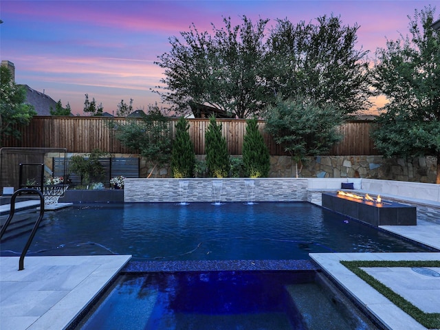 13002 Terlingua Creek Dr, Frisco, TX 75033 - view of swimming pool featuring a fire pit, a fenced backyard, and a pool with connected hot tub