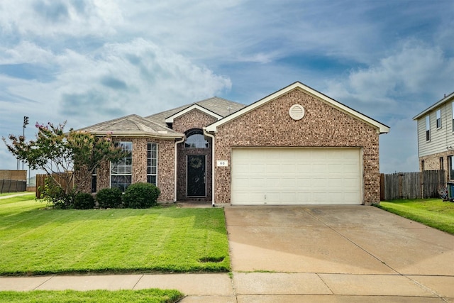 60 N Highland Dr, Sanger, TX 76266 - view of front of house featuring brick siding, driveway, and an attached garage