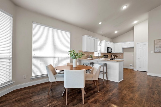 60 N Highland Dr, Sanger, TX 76266 - dining space featuring lofted ceiling, dark wood-style floors, and recessed lighting