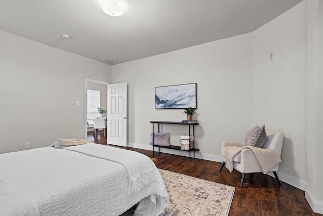 60 N Highland Dr, Sanger, TX 76266 - bedroom with wood finished floors and baseboards