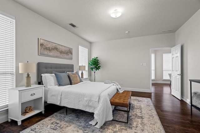 60 N Highland Dr, Sanger, TX 76266 - bedroom with dark wood finished floors and baseboards