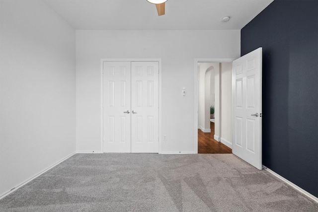 60 N Highland Dr, Sanger, TX 76266 - unfurnished bedroom with carpet, a closet, and a ceiling fan